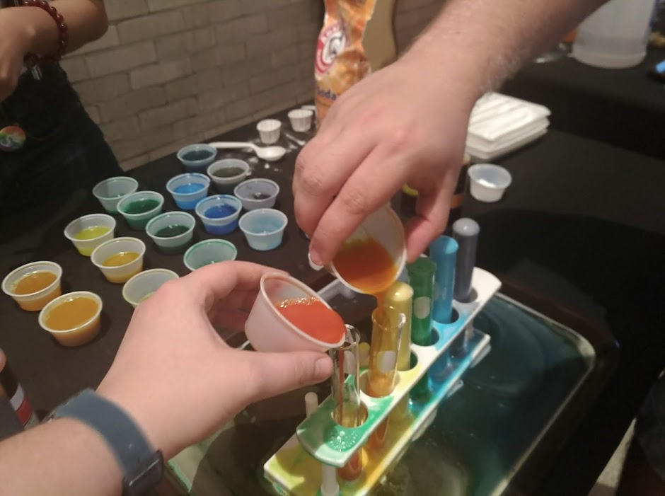 Creating a colorful reaction at the Pride Science After Hours event. 